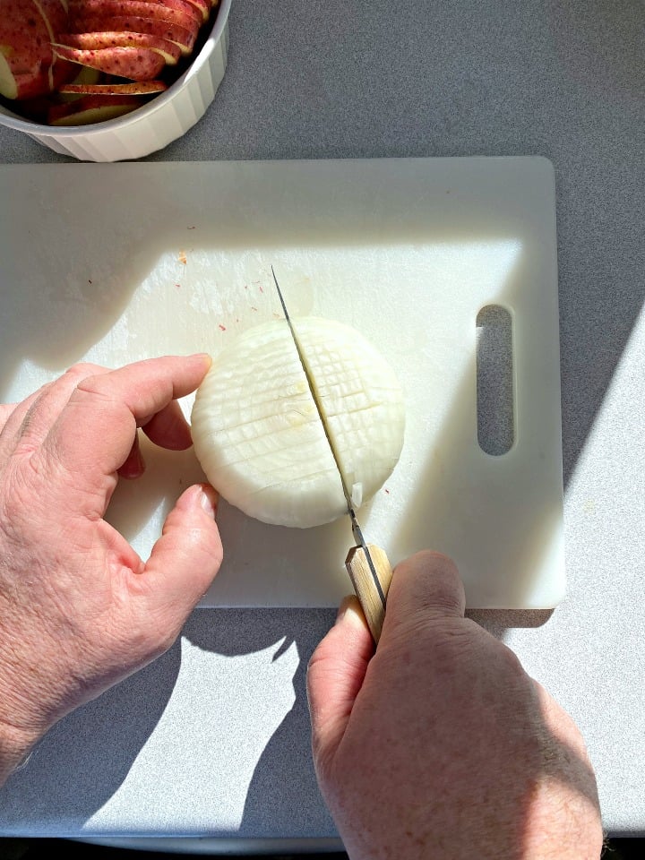 slicing a white onion