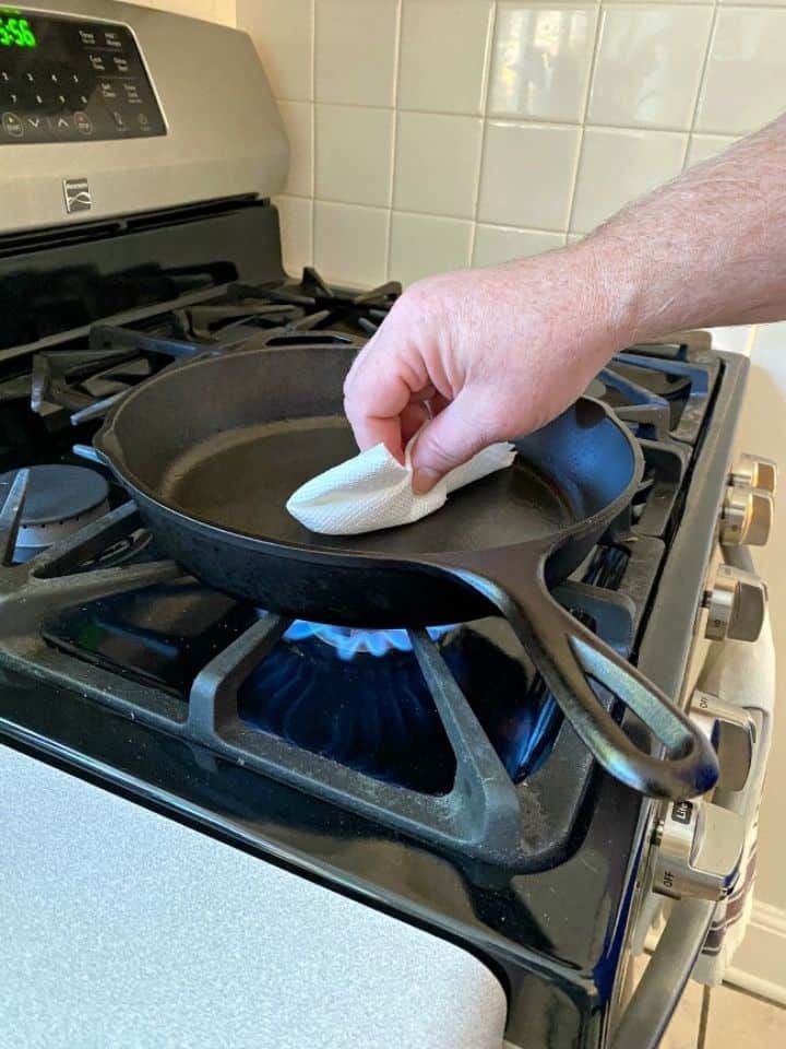 wiping out a cast iron skillet